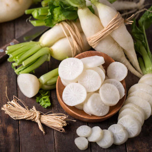 crisp, sweet Japanese Minowase Daikon radish on cutting board

