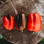 vibrant red ripe bell peppers in kitchen setting

