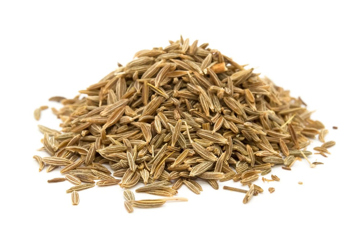 dried caraway seeds spilling from harvest basket

